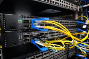 network switches with organized fiber cables in a rack for high-density data center connections